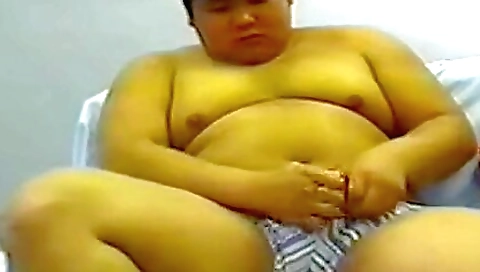 Asian brunette enjoys deepthroat and handjob on bed