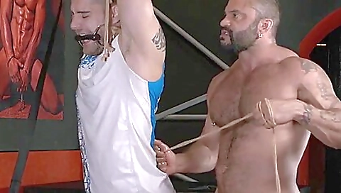 BDSM threesome with a tattooed dude and a tattooed girl