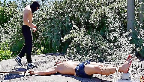 Brunette with a small body is nailed in the middle of the road