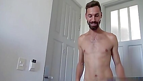 Two skinny gay men have their hands and mouths showing off