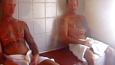 Brunette girl with tattooed body gets two huge cocks