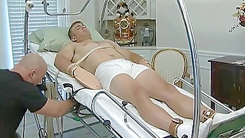 Uniform bald male jerking off his client's muscular body